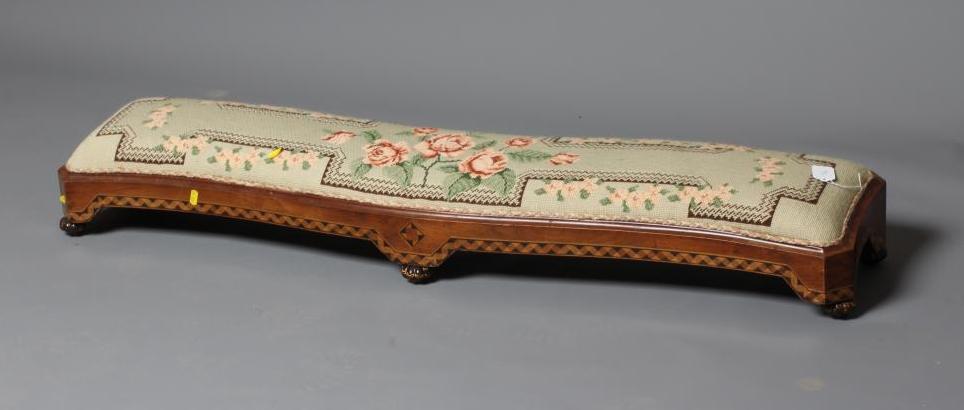 A VICTORIAN WALNUT FENDER STOOL of serpentine oblong form with parquetry banding Image