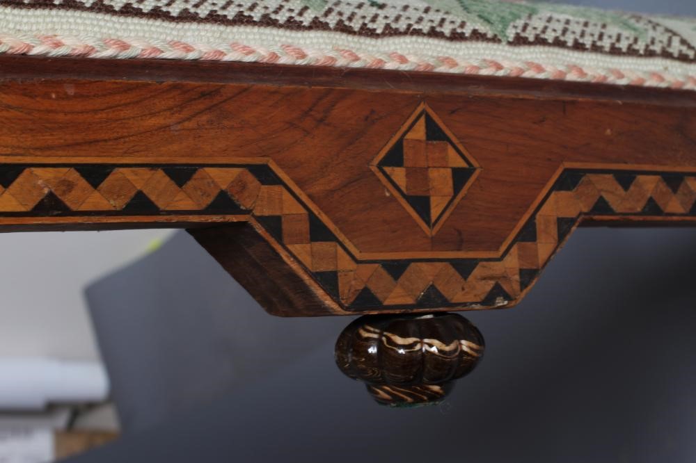 A VICTORIAN WALNUT FENDER STOOL of serpentine oblong form with parquetry banding Image
