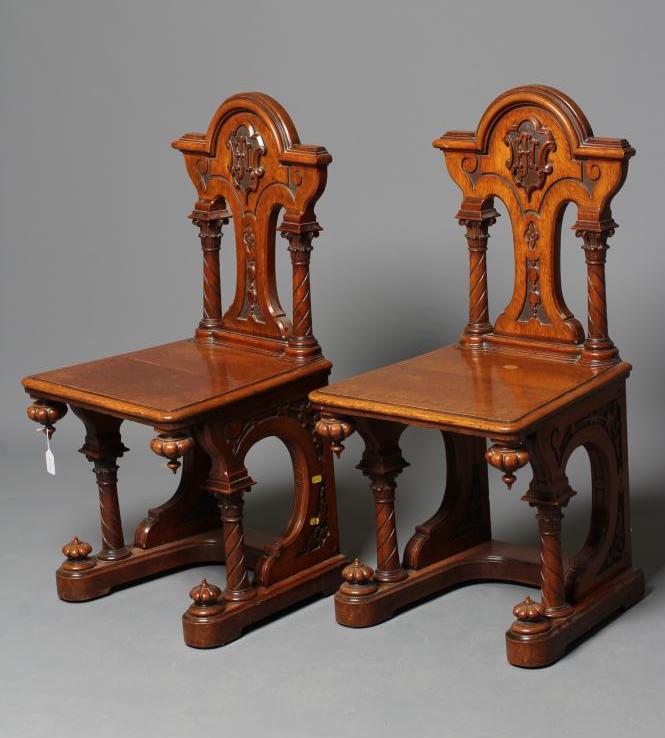 A PAIR OF VICTORIAN GOTHIC CARVED LIGHT OAK HALL CHAIRS Image