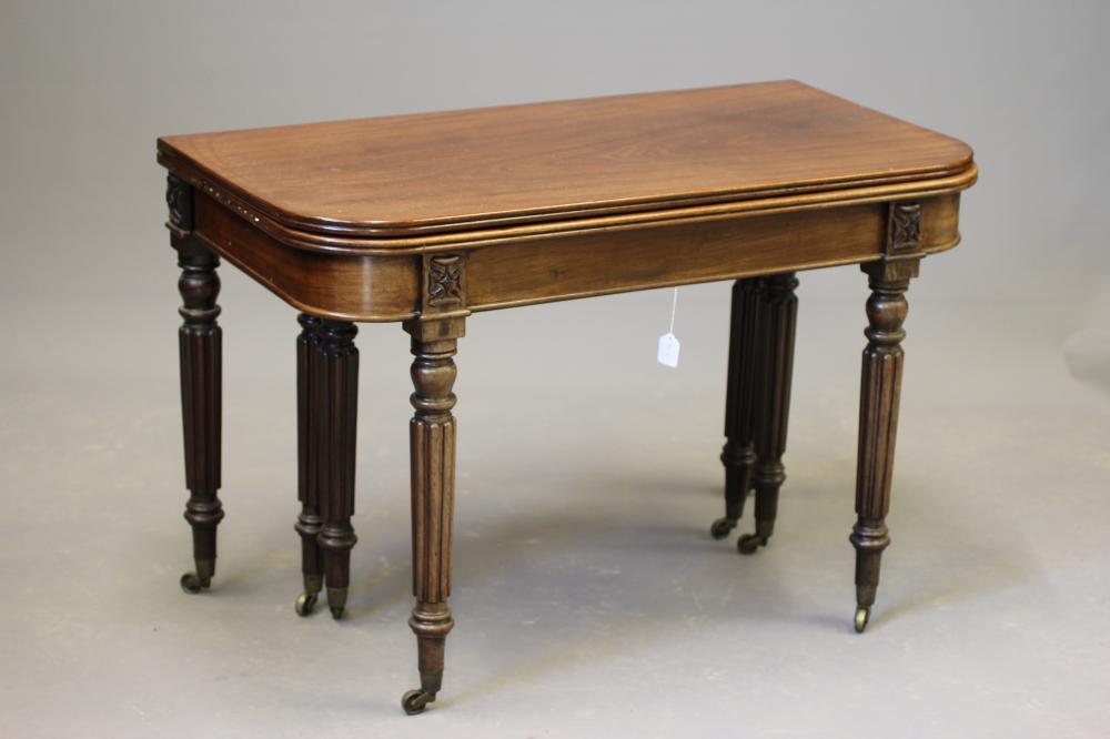 A REGENCY MAHOGANY FOLDING AND EXTENDING DINING TABLE in the manner of Gillow Image