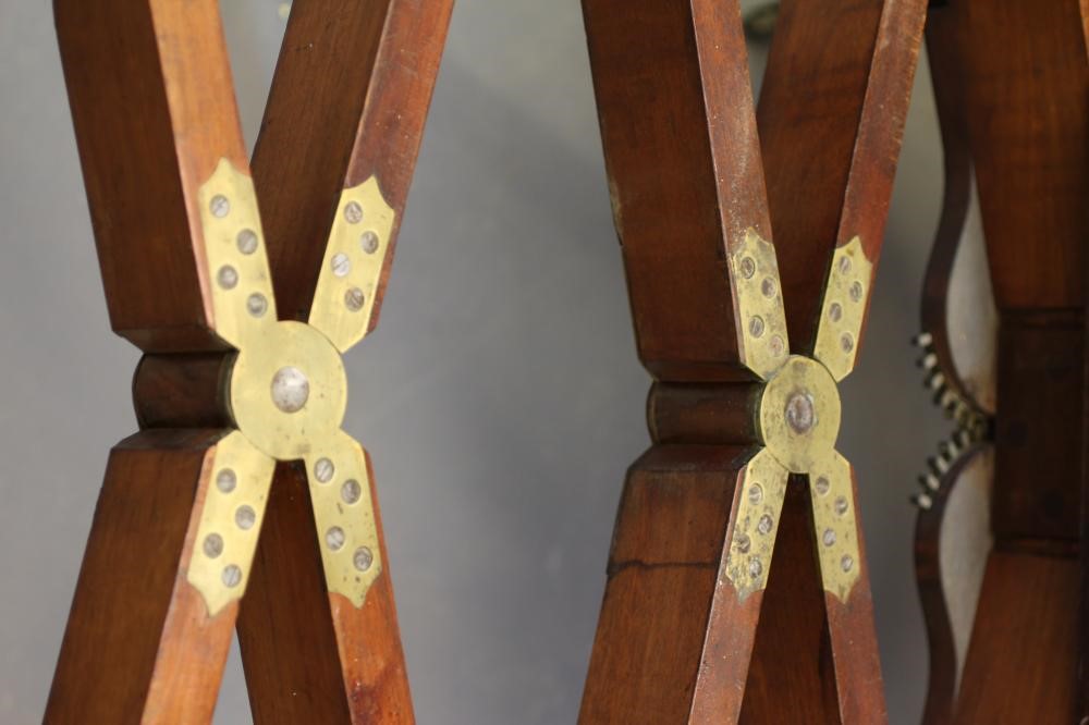 A REGENCY MAHOGANY FOLDING AND EXTENDING DINING TABLE in the manner of Gillow Image