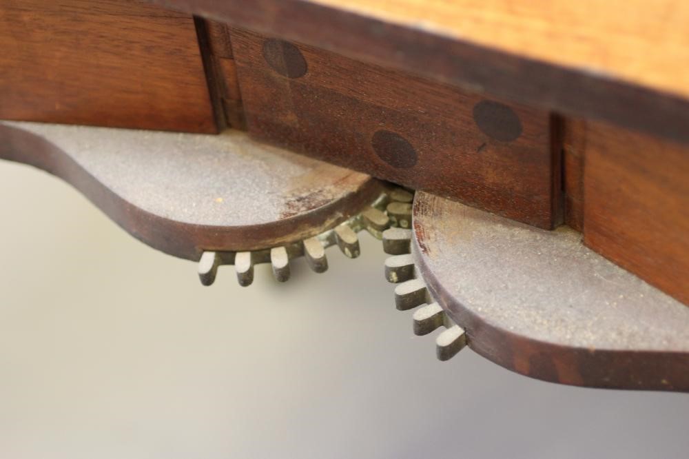 A REGENCY MAHOGANY FOLDING AND EXTENDING DINING TABLE in the manner of Gillow Image