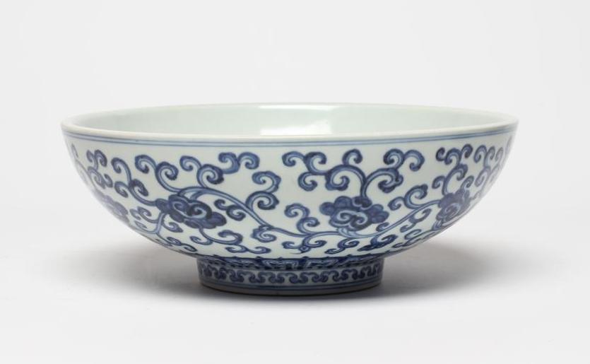 A CHINESE PORCELAIN SHALLOW BOWL of plain circular form, the exterior painted in underglaze blue Image
