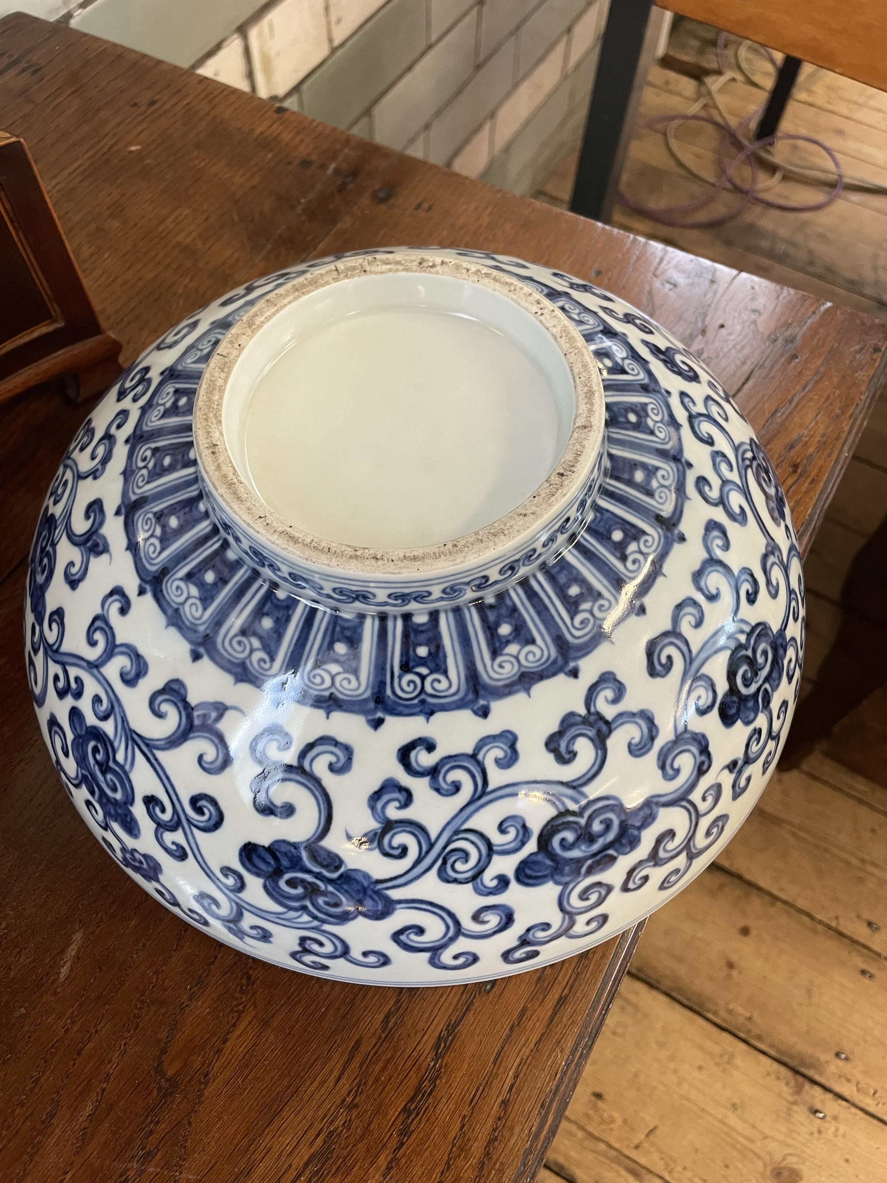 A CHINESE PORCELAIN SHALLOW BOWL of plain circular form, the exterior painted in underglaze blue Image