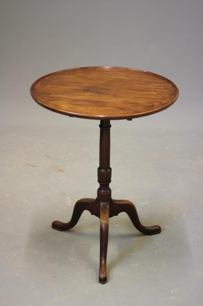 A GEORGIAN MAHOGANY TILT TOP TABLE, c.1800, the dished circular top on turned vase stem, the tripod Image