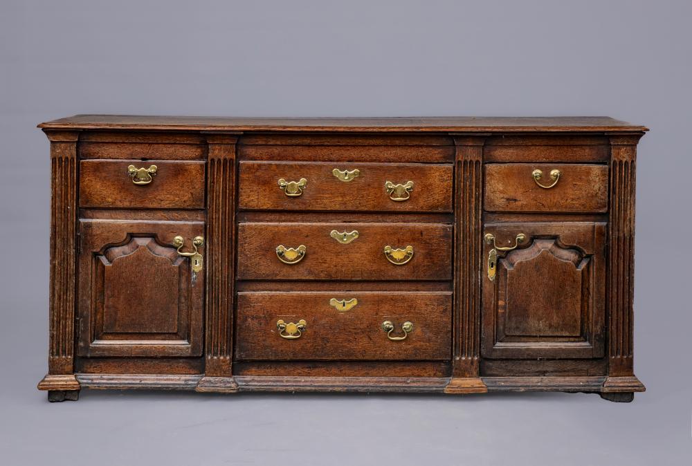 A GEORGIAN OAK ENCLOSED LOW DRESSER Image