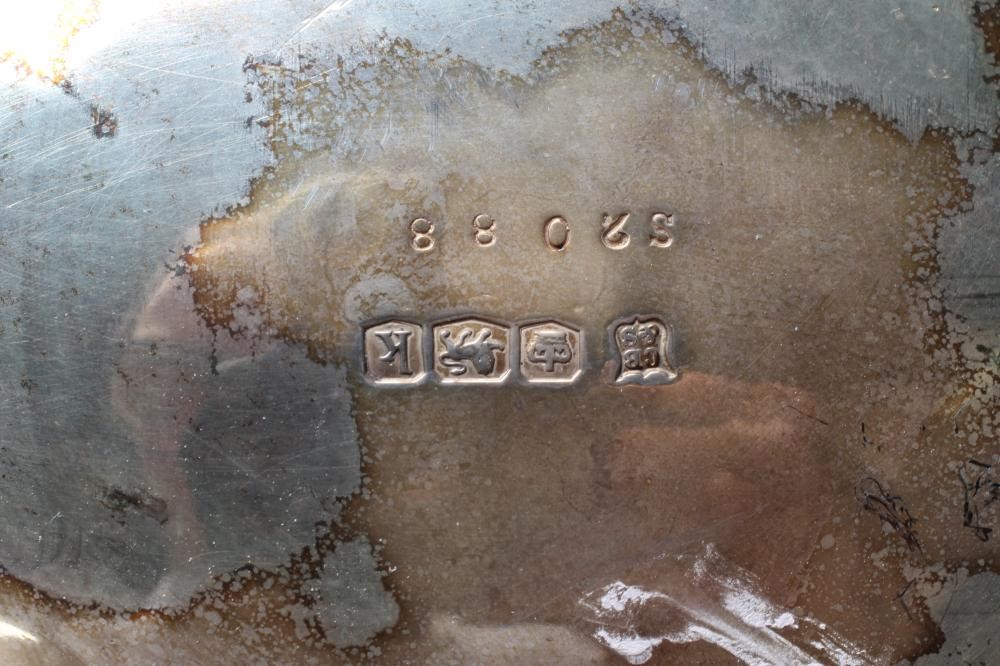 A SILVER COFFEE POT Image