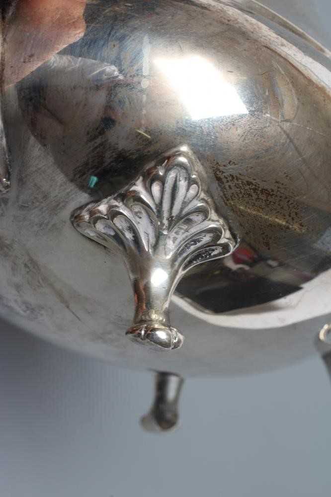 A SILVER COFFEE POT Image