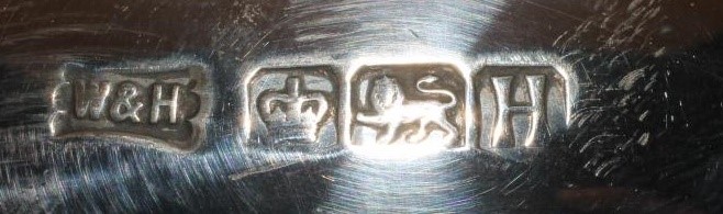 A SILVER TEAPOT AND COFFEE POT Image