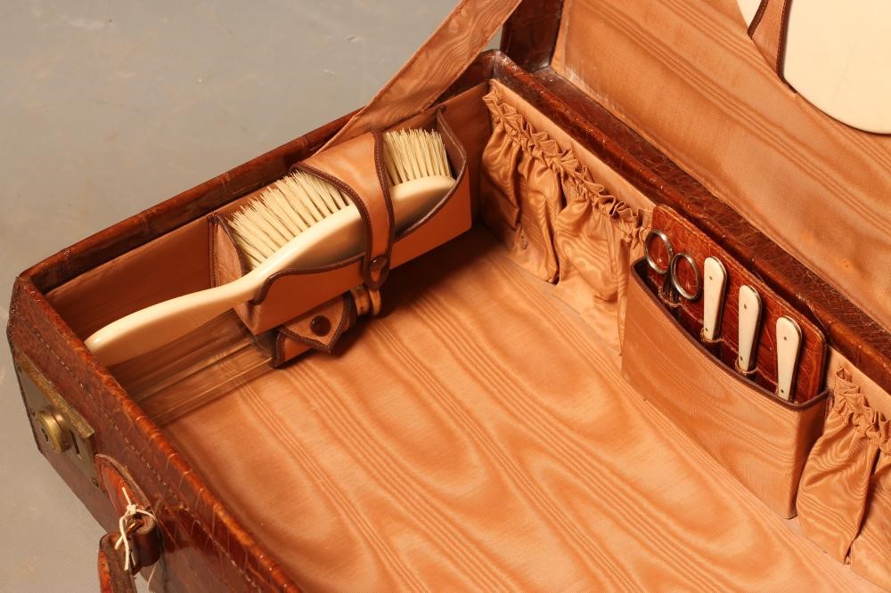 A CROCODILE SKIN TRAVELLING DRESSING CASE Image