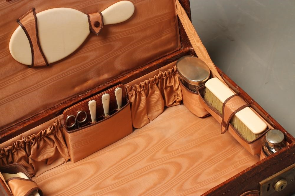 A CROCODILE SKIN TRAVELLING DRESSING CASE Image