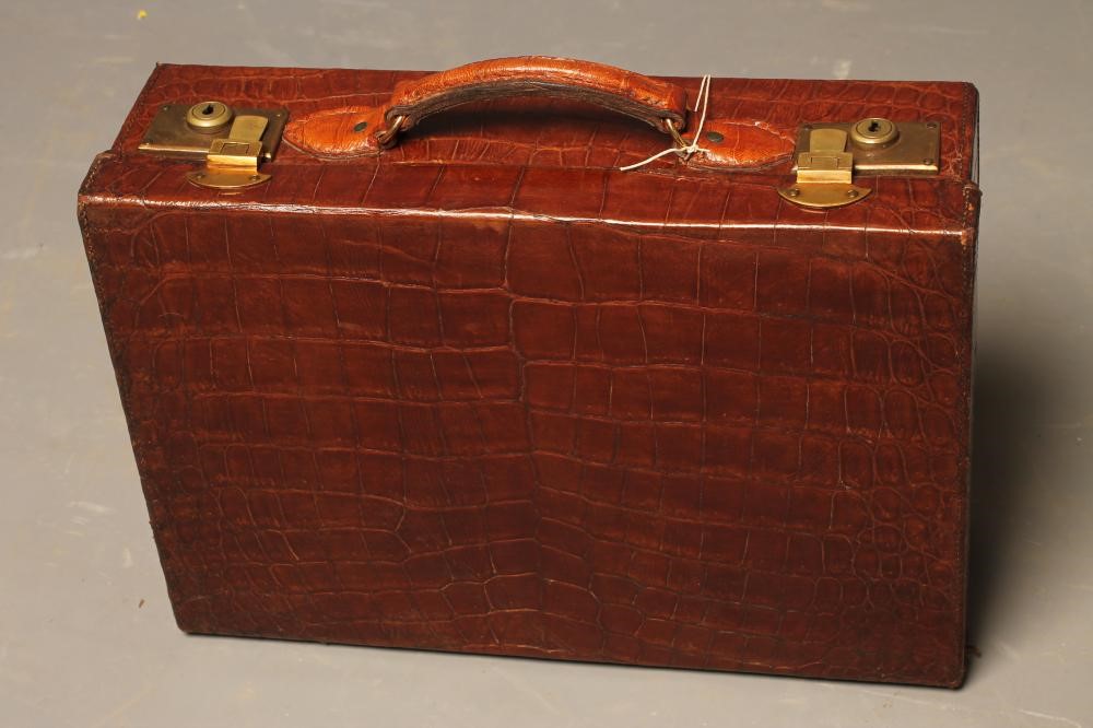 A CROCODILE SKIN TRAVELLING DRESSING CASE Image