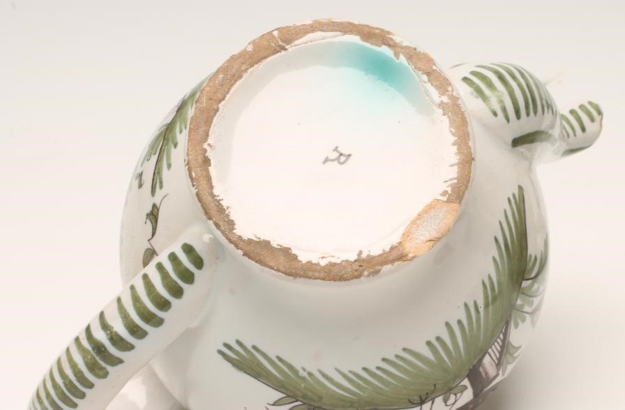 TWO FRENCH FAIENCE TEAPOTS Image