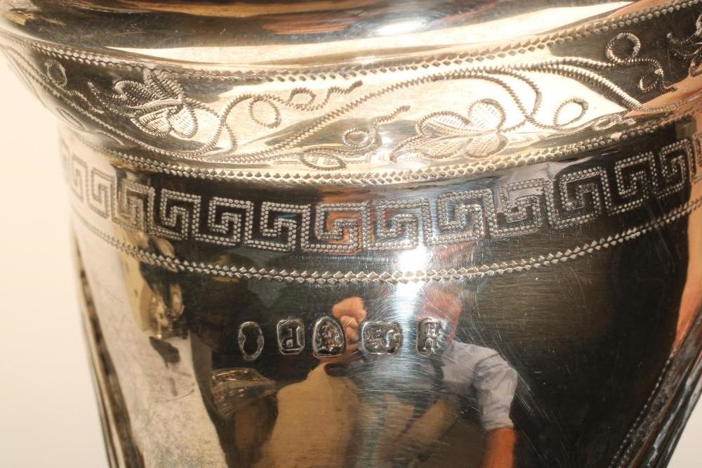 A GEORGE III SILVER MILK jug Image