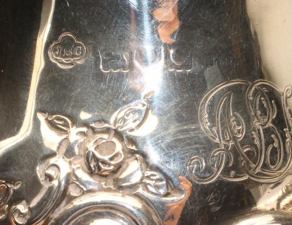 A LATE VICTORIAN SILVER MILK JUG Image