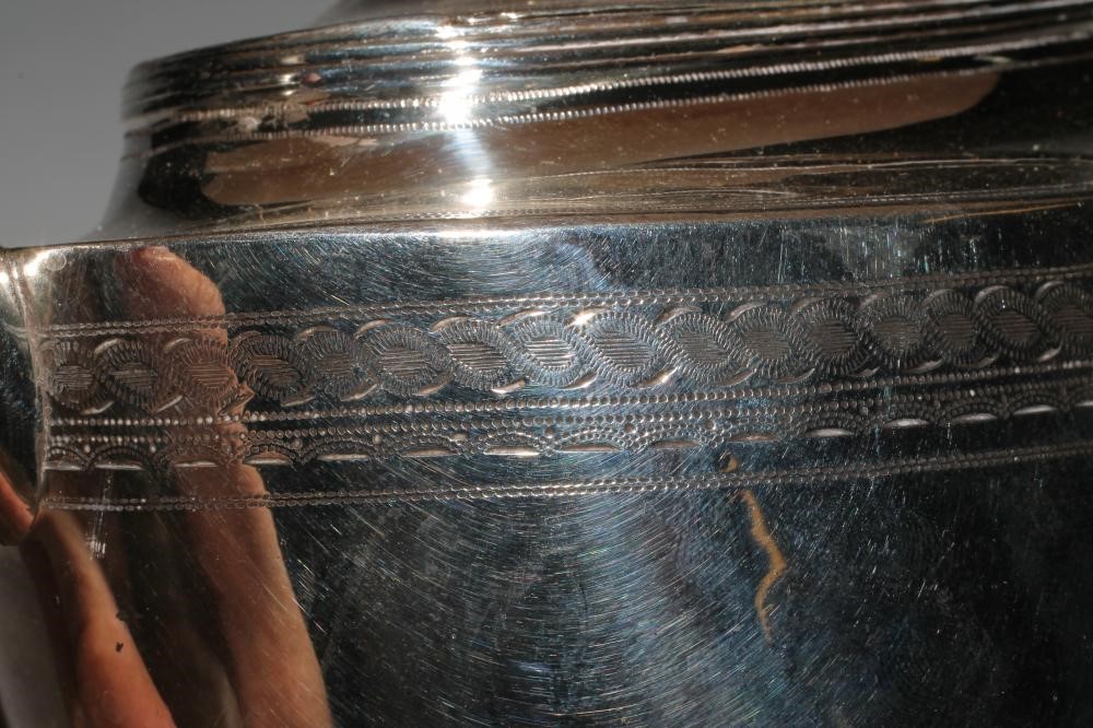 A LATE GEORGE III SILVER TEAPOT Image