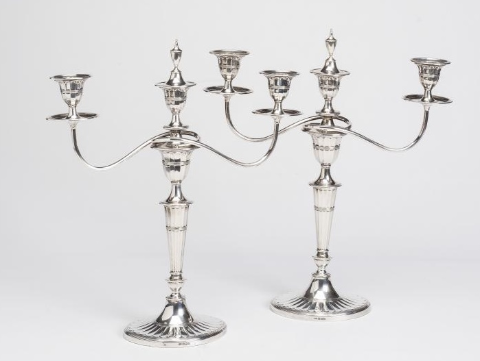 AN EDWARDIAN SILVER PAIR OF TWO BRANCH THREE LIGHT CANDELABRA Image