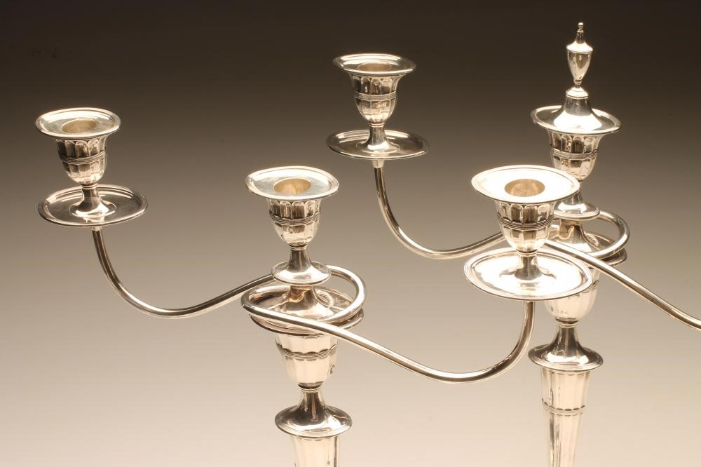 AN EDWARDIAN SILVER PAIR OF TWO BRANCH THREE LIGHT CANDELABRA Image