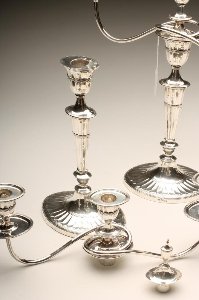 AN EDWARDIAN SILVER PAIR OF TWO BRANCH THREE LIGHT CANDELABRA Image