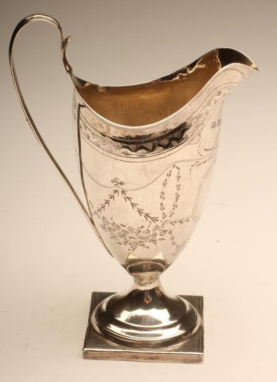A GEORGE III SILVER MILK JUG Image