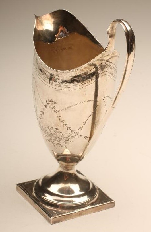 A GEORGE III SILVER MILK JUG Image