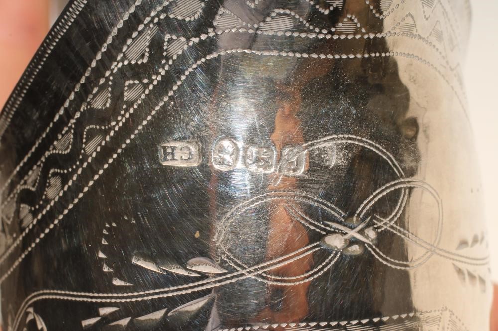 A GEORGE III SILVER MILK JUG Image