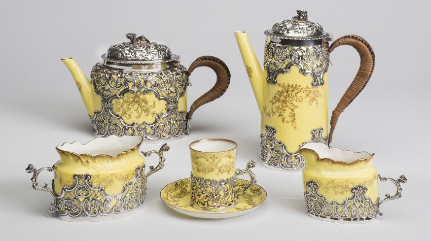 A CROWN STAFFORDSHIRE "EGGSHELL" CHINA AND SILVER FOUR PIECE TEA AND COFFEE SET Image