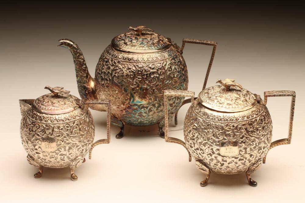 AN EASTERN WHITE METAL THREE PIECE TEA SERVICE Image