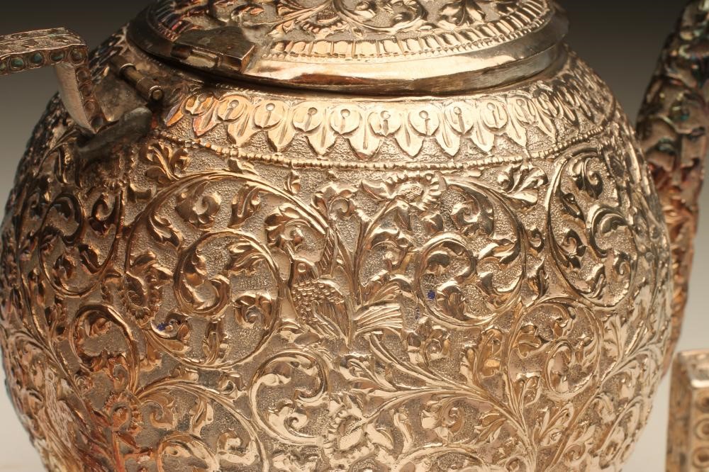 AN EASTERN WHITE METAL THREE PIECE TEA SERVICE Image