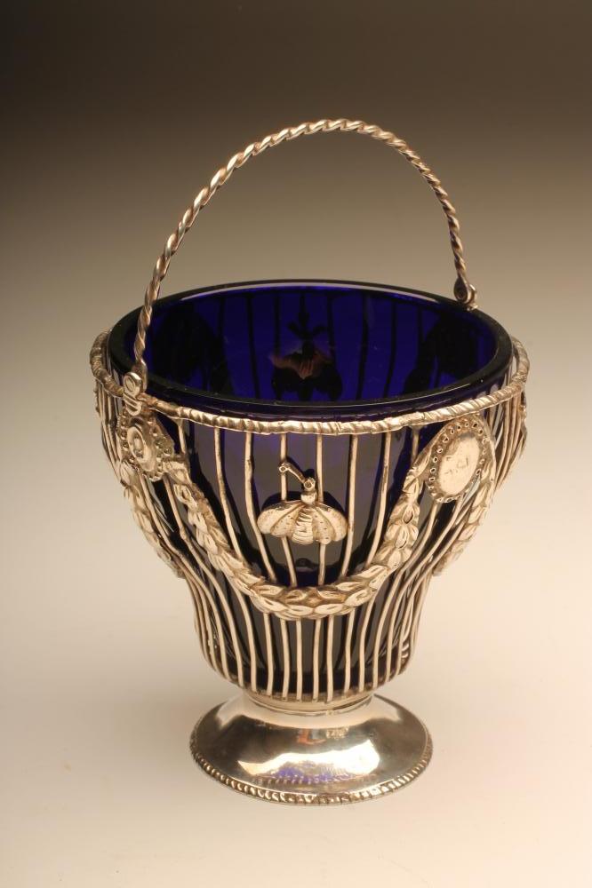 A GEORGE III SILVER WIREWORK SUGAR BASKET Image