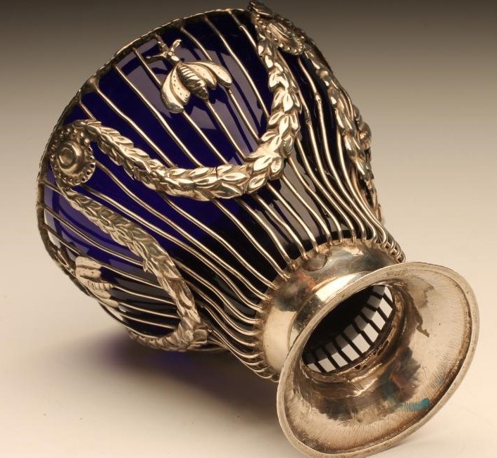 A GEORGE III SILVER WIREWORK SUGAR BASKET Image