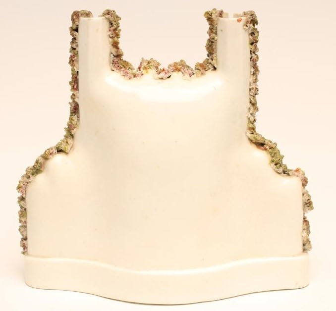 A VICTORIAN STAFFORDSHIRE PORCELLANEOUS FLATBACK MODEL of Trinity College encrusted with shredded Image