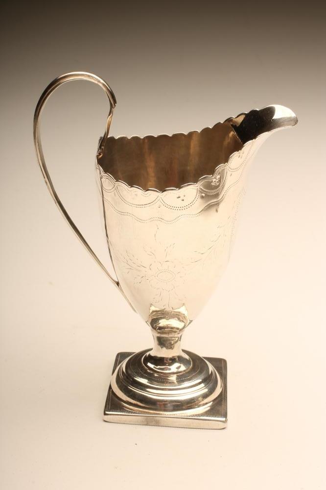A GEORGE III SILVER MILK JUG Image