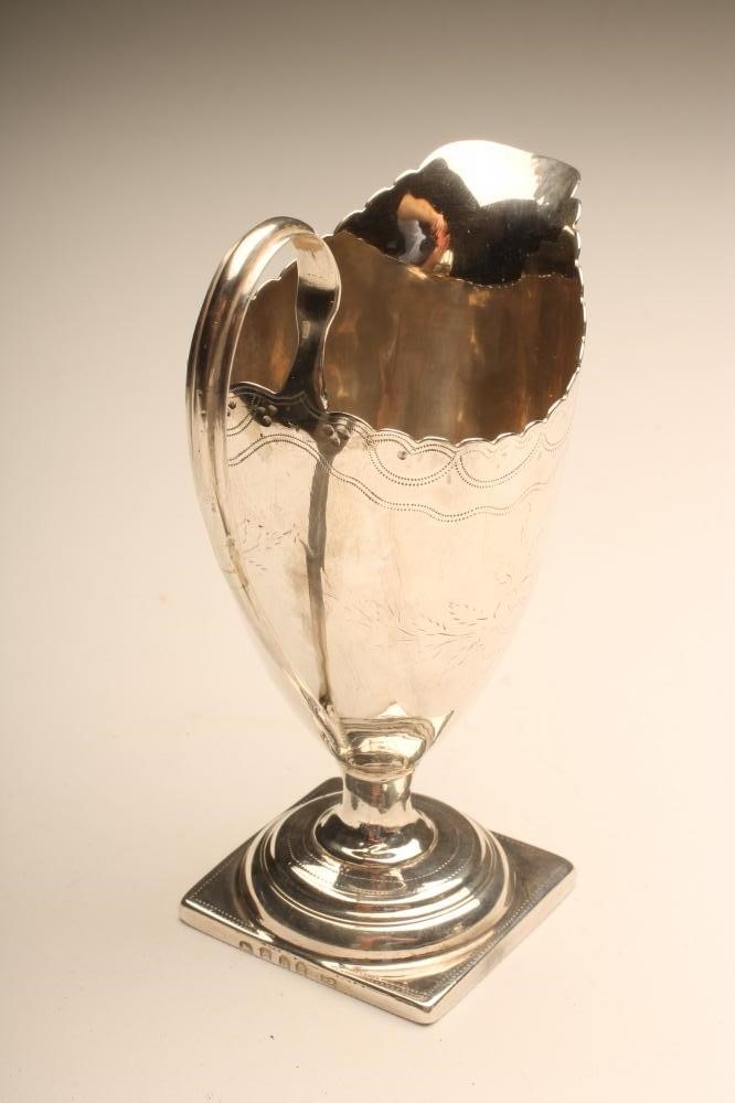A GEORGE III SILVER MILK JUG Image