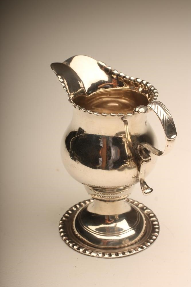 A LATE VICTORIAN SILVER MILK JUG Image