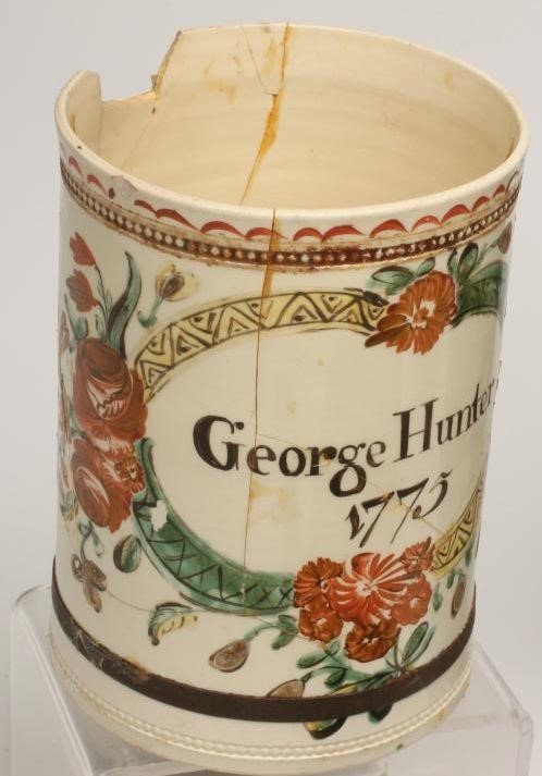 A DOCUMENTARY CREAMWARE MUG of cylindrical form Image