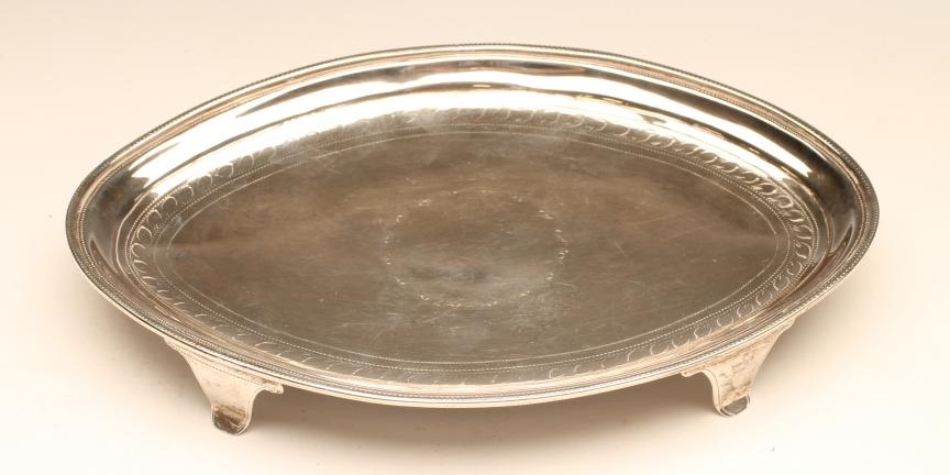 A GEORGE III SILVER TEAPOT STAND Image