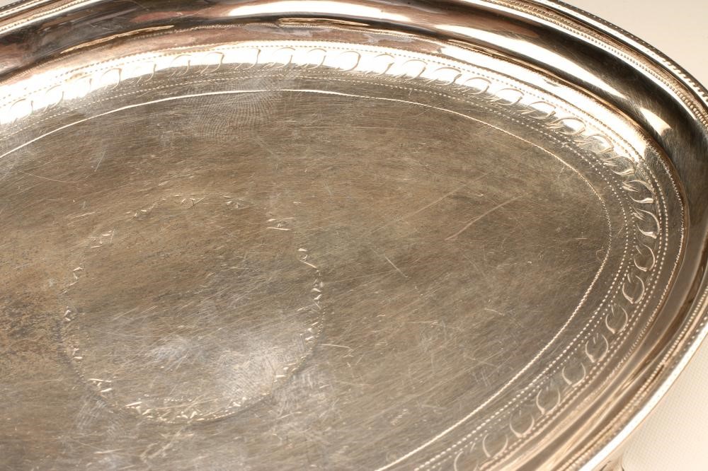 A GEORGE III SILVER TEAPOT STAND Image