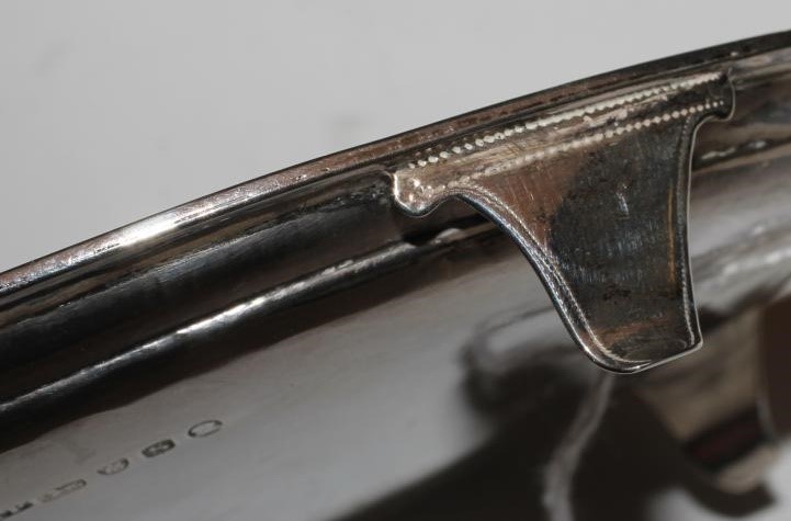 A GEORGE III SILVER TEAPOT STAND Image