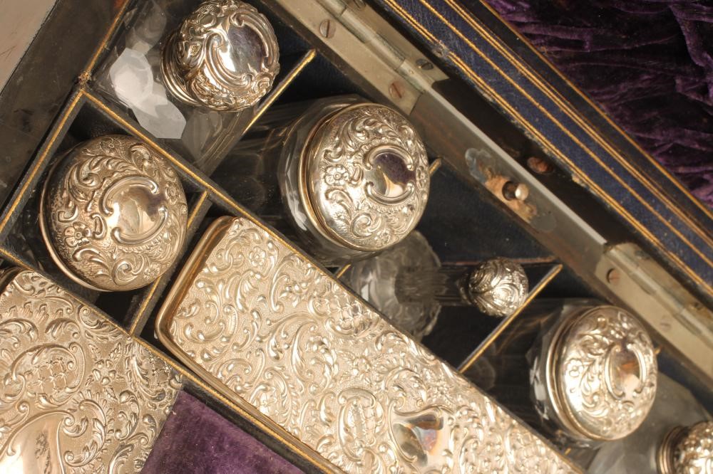 AN EDWARDIAN WALNUT TRAVELLING DRESSING CASE Image