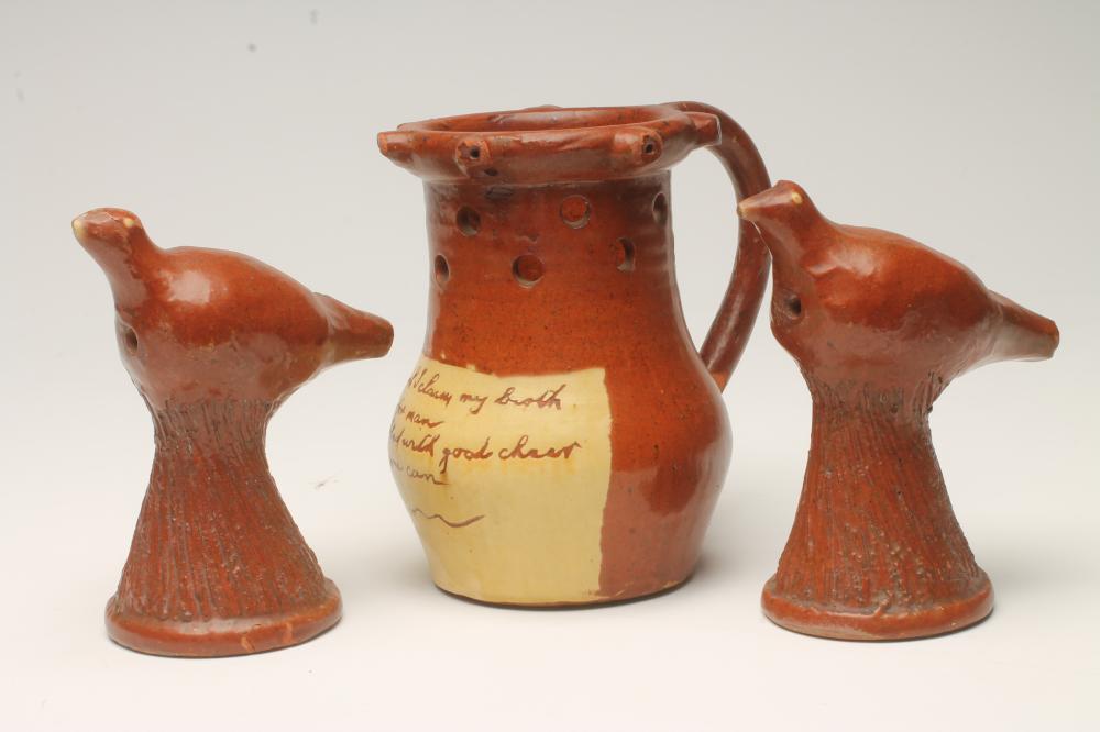 A SLIPWARE PUZZLE JUG Image