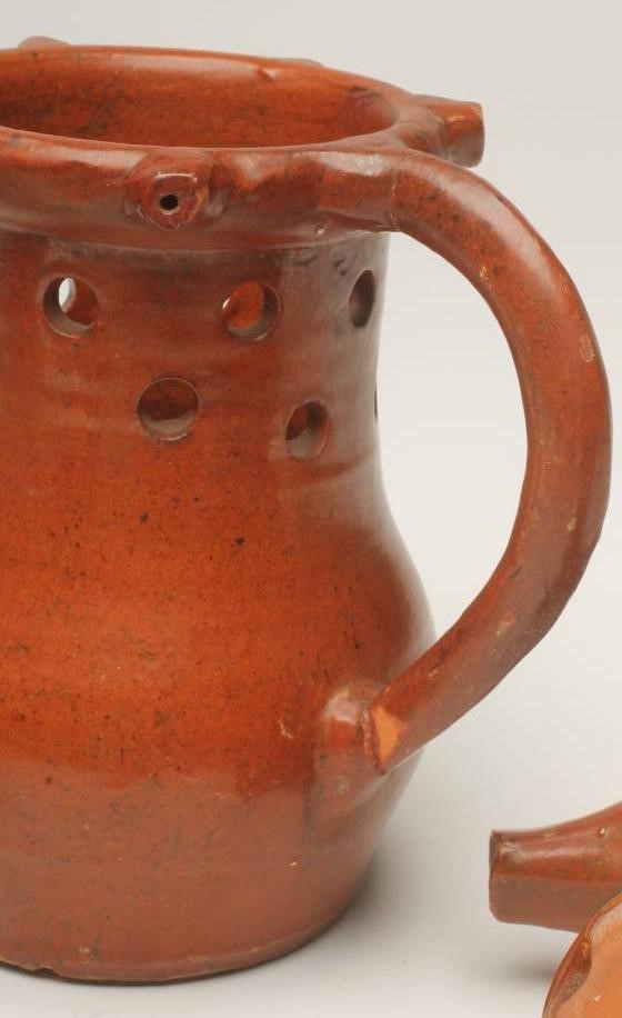 A SLIPWARE PUZZLE JUG Image