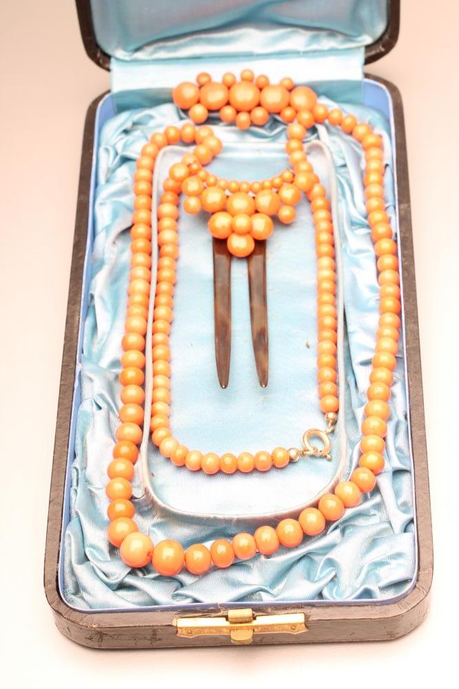 A VICTORIAN CORAL SUITE comprising a 24 1/2" long single string of graduated beads Image