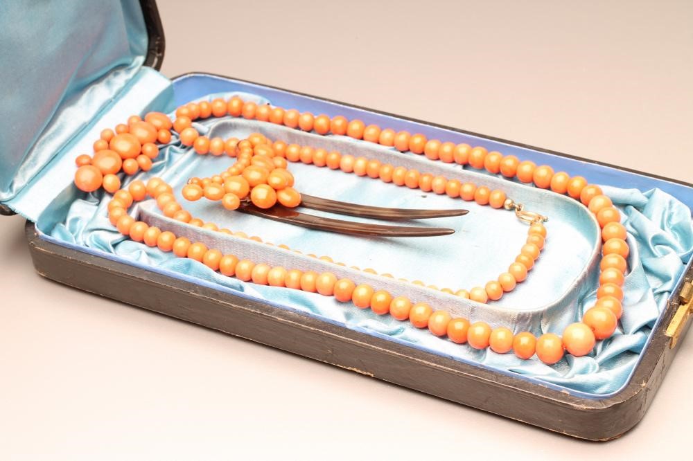 A VICTORIAN CORAL SUITE comprising a 24 1/2" long single string of graduated beads Image