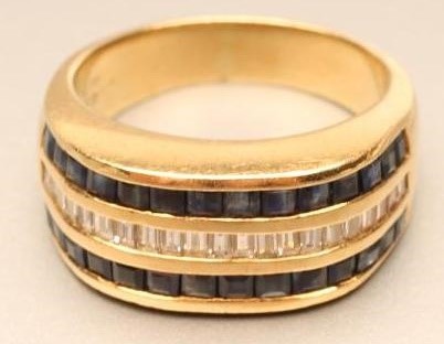 A DIAMOND AND SAPPHIRE HALF HOOP DRESS RING Image