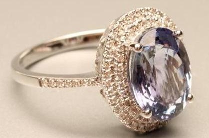 A TANZANITE AND DIAMOND RING Image