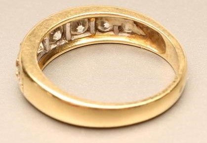 A SEVEN STONE DIAMOND RING Image