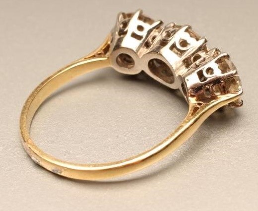 A THREE STONE DIAMOND RING Image