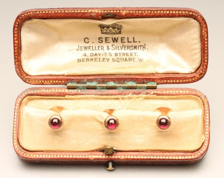 A SET OF THREE 9CT GOLD SHIRT STUDS each set with a cabochon polished ruby Image