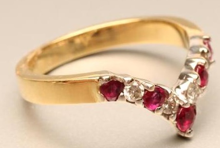 A RUBY AND DIAMOND WISHBONE RING Image